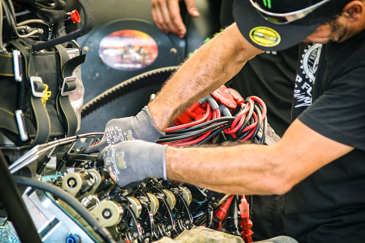 Professional mobile mechanic working on a vehicle